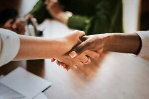 close up of two people shaking hands